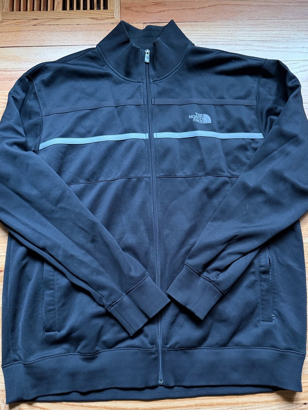 The North Face Black Jacket with Light Gray Logo and Stripe